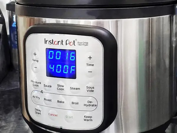 Price
The Instant Pot Duo Crisp’s controls are shown close up for our 2022 review.
James Brains/Insider
Winner: Instant Pot Duo Crisp

The MSRP of the Ninja Foodi Deluxe XL Cooker & Air Fryer is about $250. The Instant Pot Duo Crisp is $200. As I write this, both are marked down to $200 and $160, respectively. The Duo Crisp is more affordable, but these appliances regularly go on sale. For example, late last year, the Ninja Foodi was marked down to $140. The Duo Crisp was $108. So, watch out for sales, especially around Black Friday and Cyber Monday.